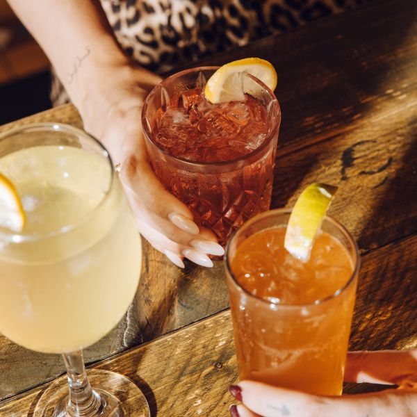 Three friends sharing Spritzes